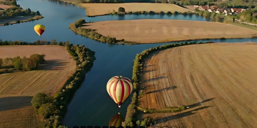 A hot air balloon is flying over a field