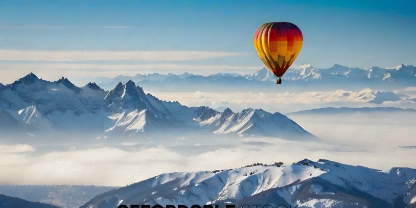 A hot air balloon is flying over a mountain range