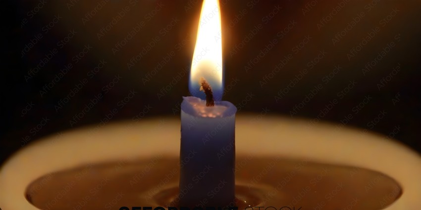 A single candle with a blue flame