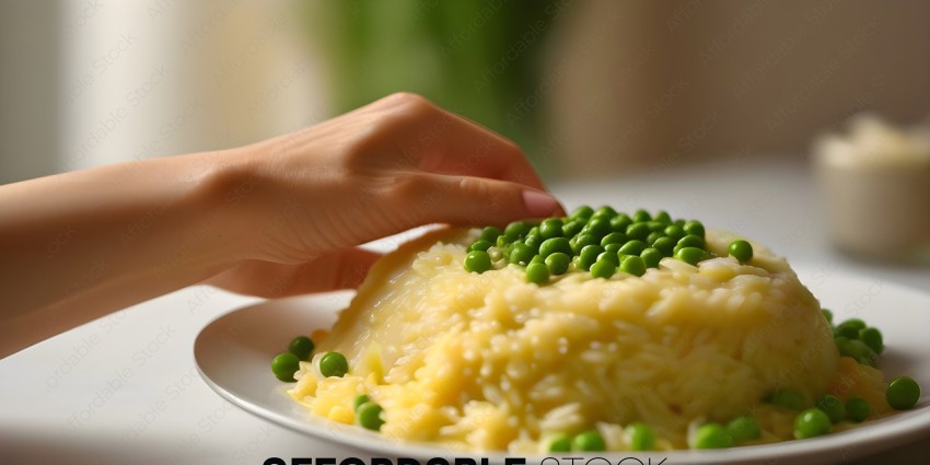 A person is picking up peas from a plate of pasta