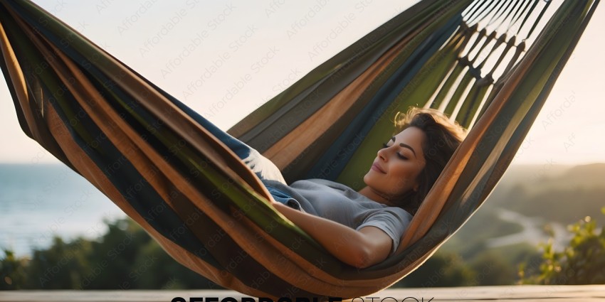 A woman in a hammock smiles at the camera