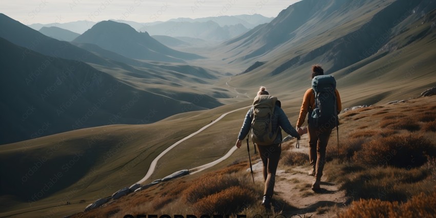Two Hikers Walking on a Mountain Path