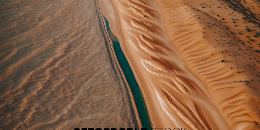 A sand dune with a river running through it