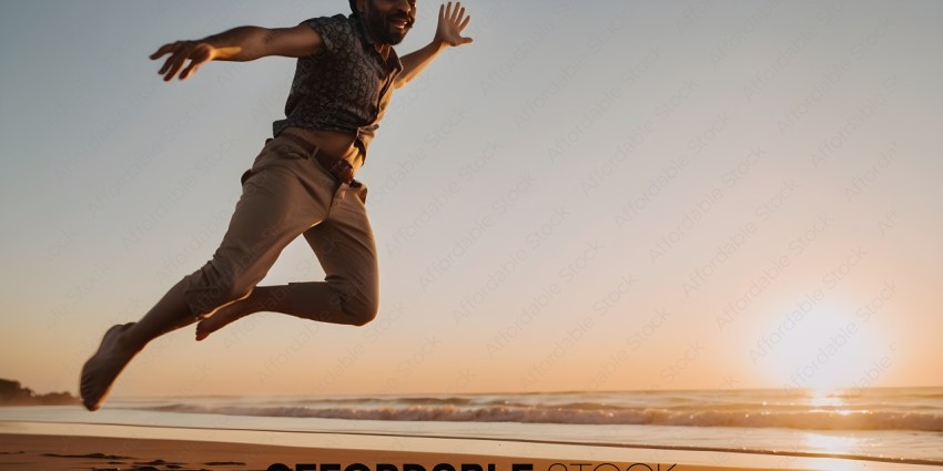 A man jumps on the beach with the ocean in the background