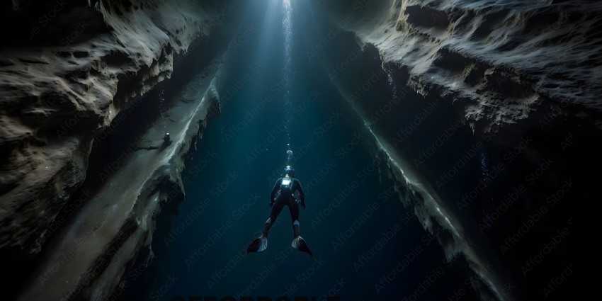 Diver in a cave with a light on his head