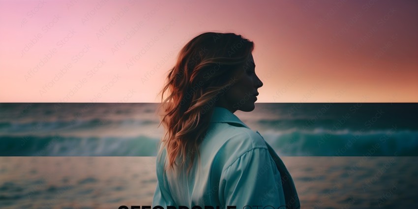 A woman in a light blue shirt looking out at the ocean