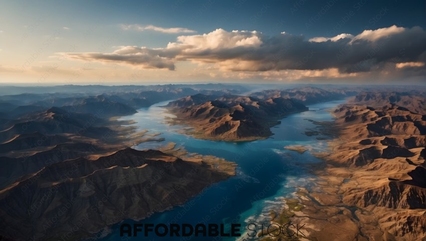 Aerial View of a Serene Lake and Rugged Mountains at Sunset