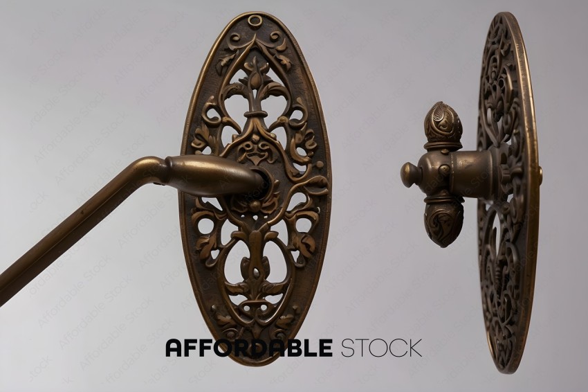 A decorative metal handle with a design on it