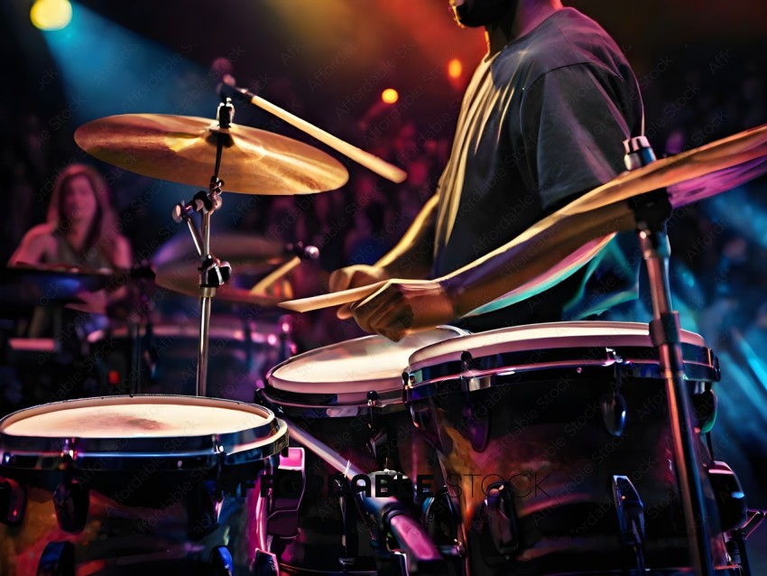 A man playing the drums in a concert