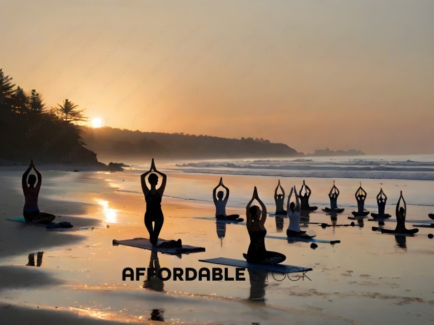 Yoga practitioners meditate on the beach at sunset
