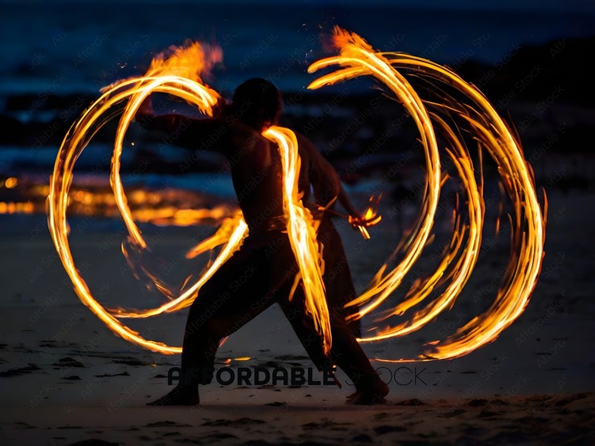 Man performing fire dance on beach at night