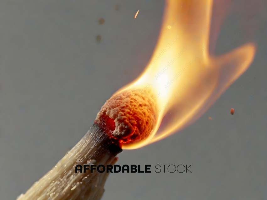 A burning matchstick with a red tip