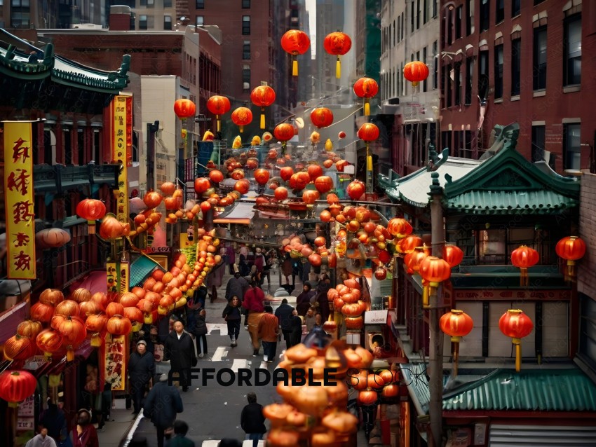 People walking down a street with red lanterns