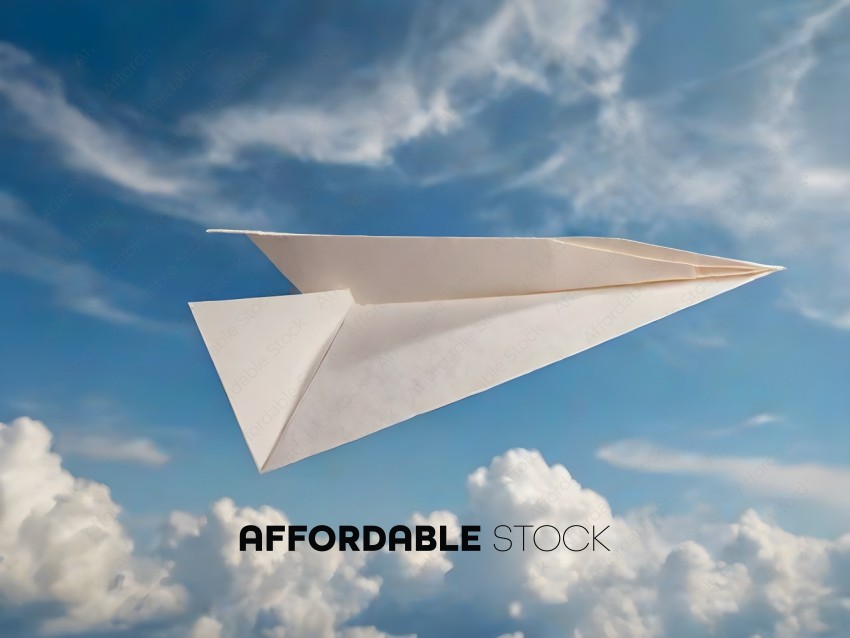 A white paper airplane flies through the sky