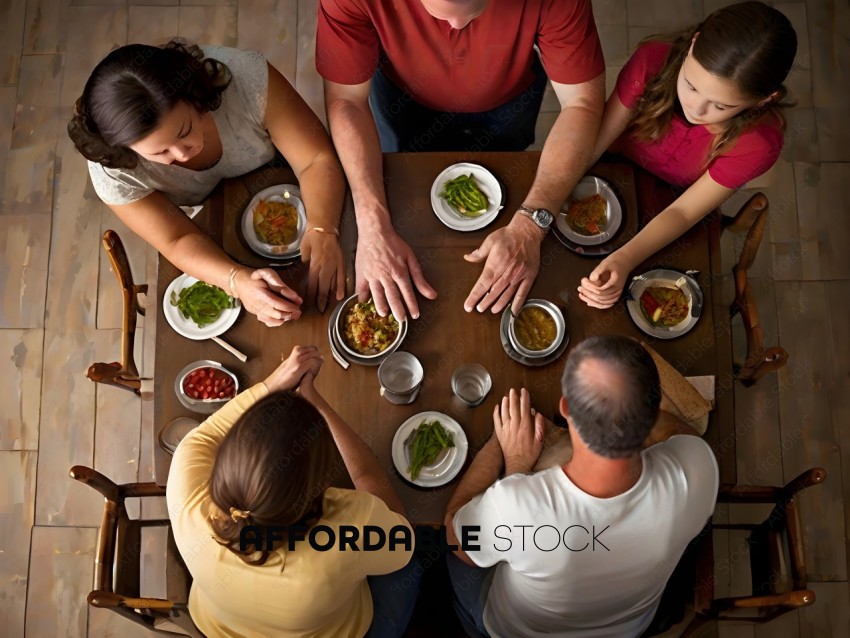A family of five sitting around a table eating