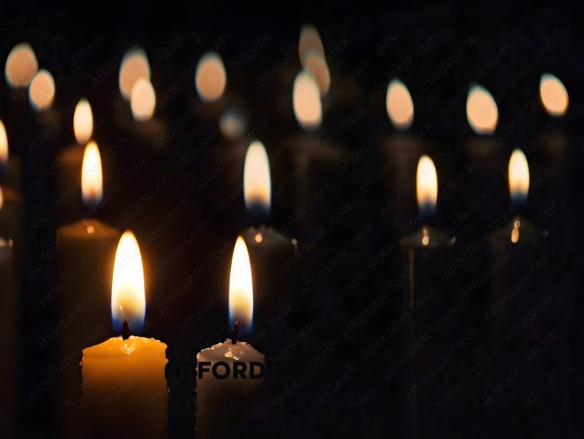 Candles with flames in a dark room