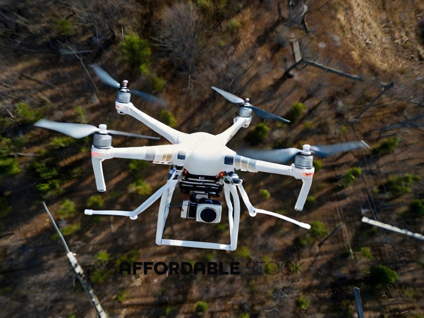 A drone flying over a wooded area