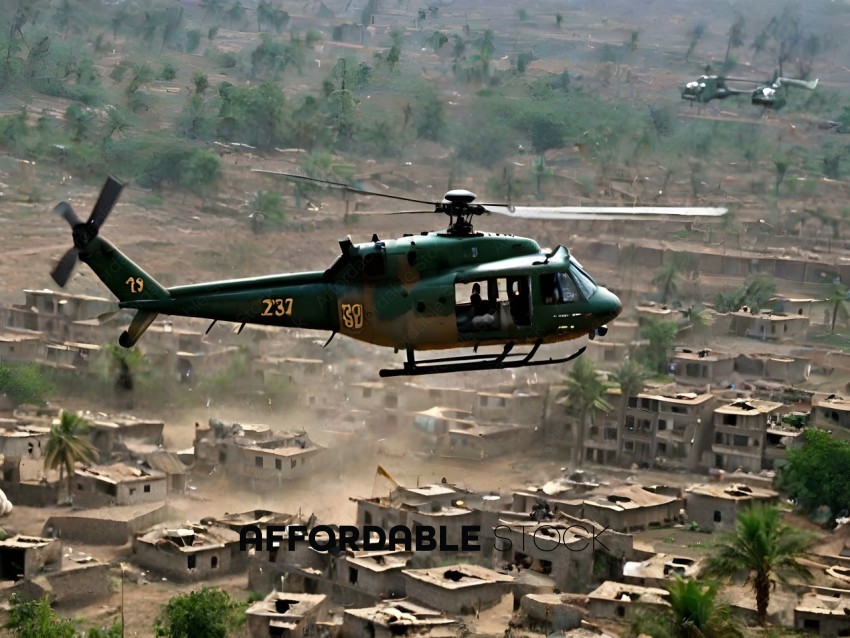 A green helicopter flying over a village