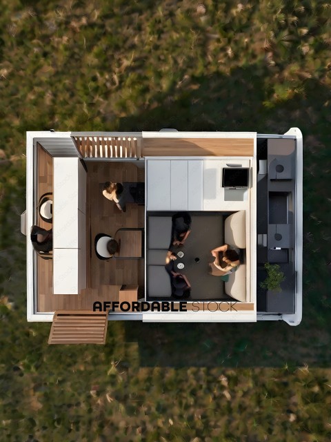 A group of people are sitting in a small house