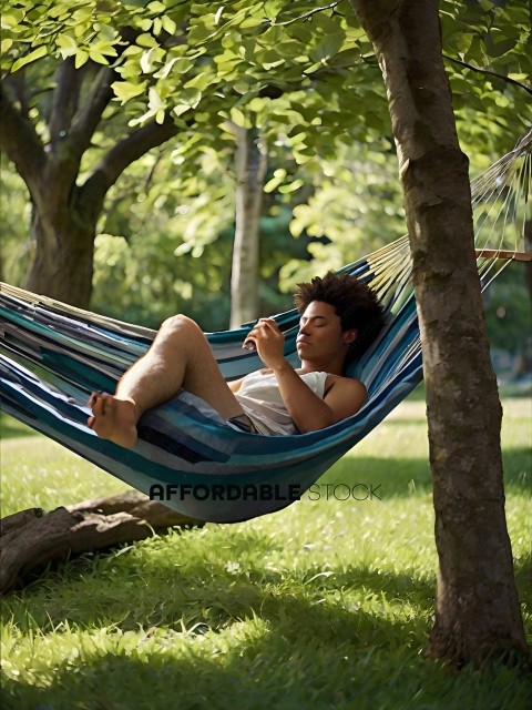 Man in hammock using cell phone