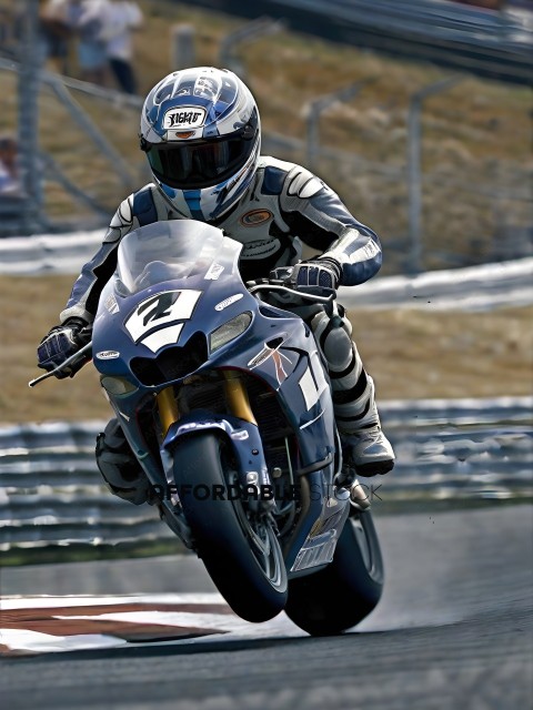 A motorcycle racer wearing a blue and white uniform