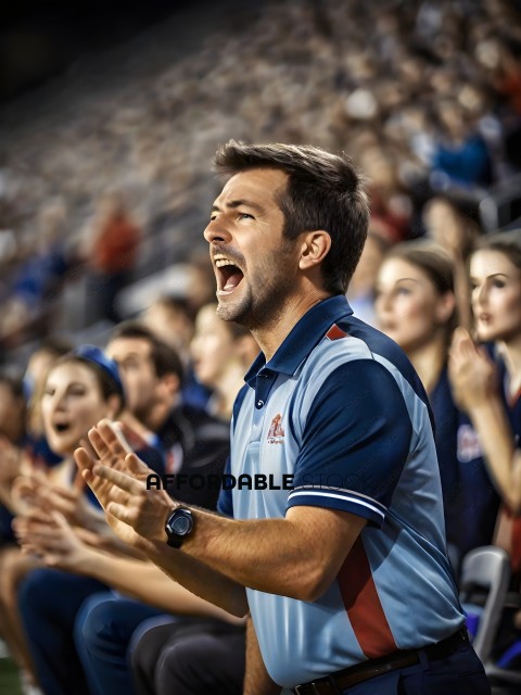 Man in blue shirt with red stripe yelling at a game