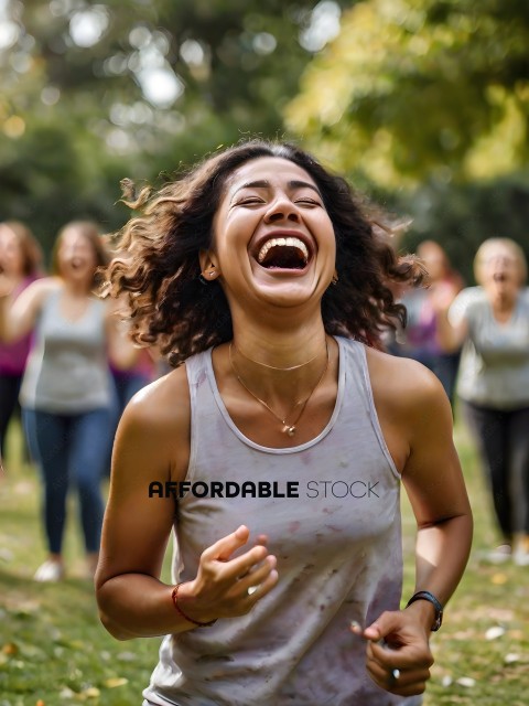 A woman laughing with a group of people