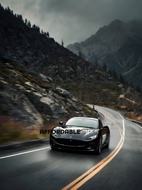 A black car driving down a mountain road