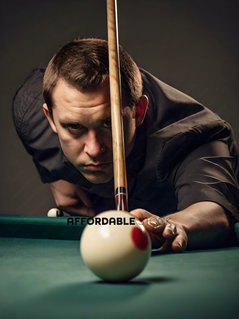 Man with a pool cue looking at the ball