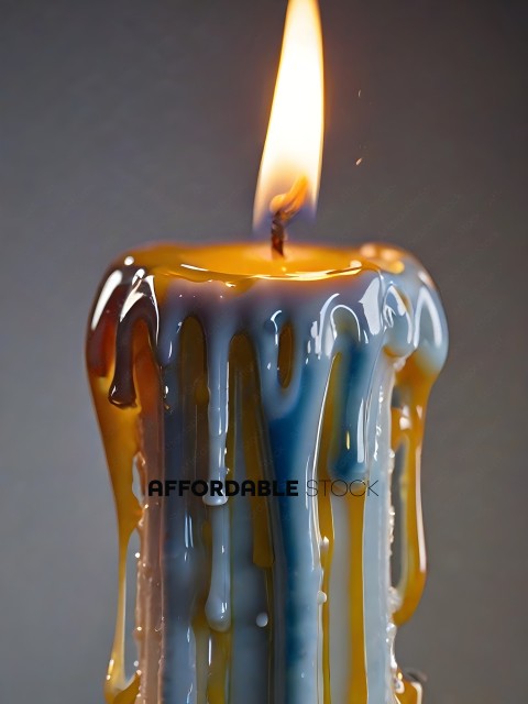 A candle with a blue and yellow wax