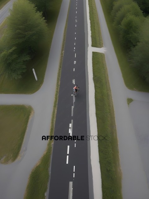 A person riding a bike on a road