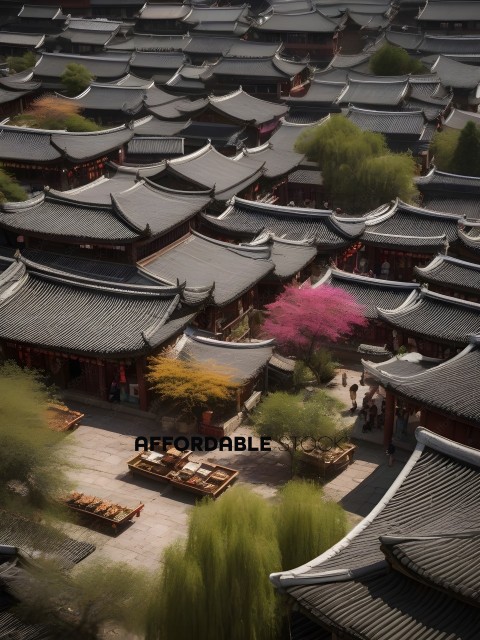 A view of many buildings with a pink tree in the middle