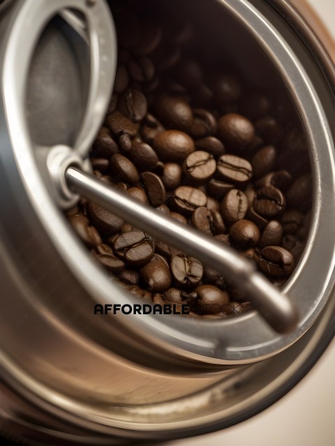 A close up of a coffee grinder with coffee beans