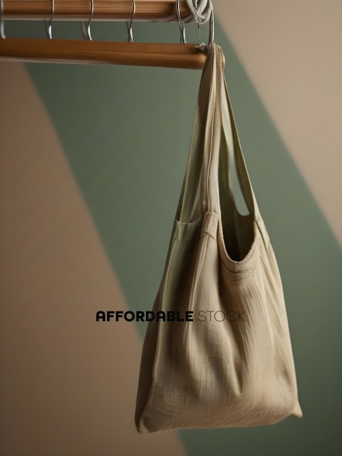 A tan handbag with a wooden handle