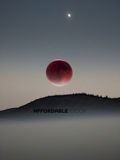 A red moon rises over a mountain range