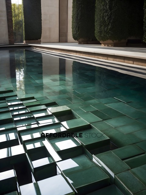 A reflection of a pool with green tiles