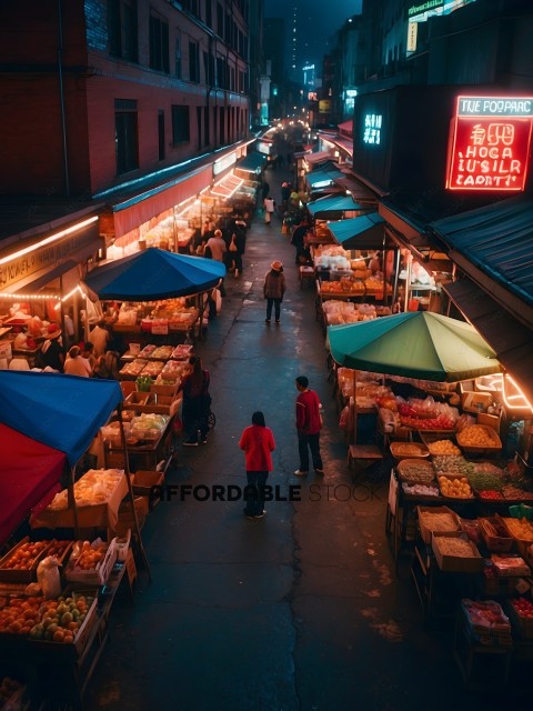 People shopping at an outdoor market at night