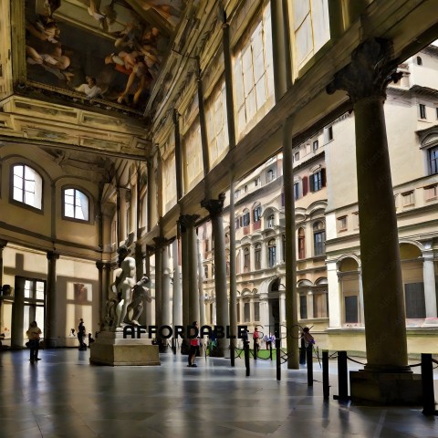 People in a large building with statues and columns