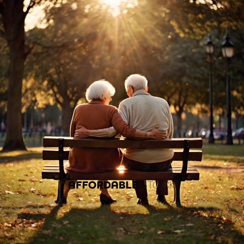 An elderly couple sitting on a bench in a park