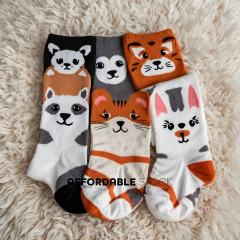 Four socks with animals on them