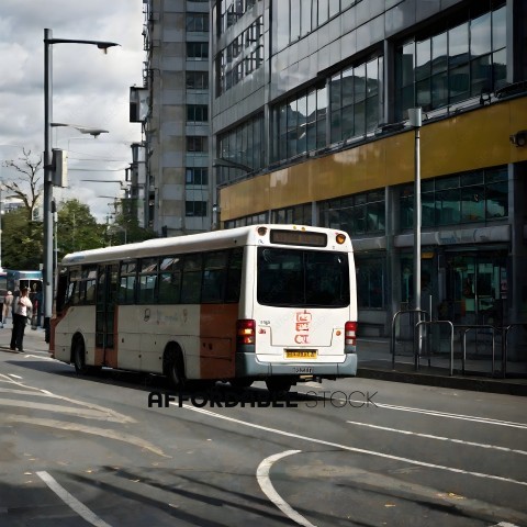 A white and orange bus on a city street