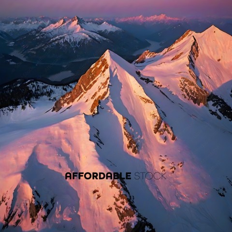 Snowy Mountain Range with Pink Sunset