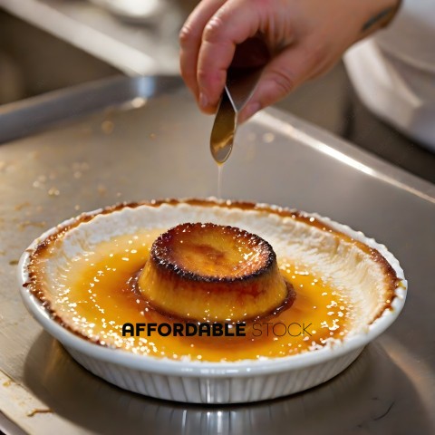 A person pouring syrup on a dessert