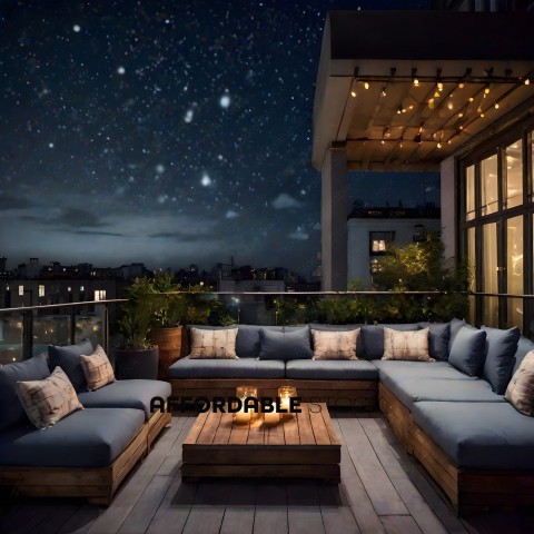 A patio with a table and couches lit by candles