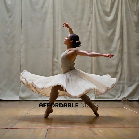 A female ballerina in a white tutu and leggings dancing