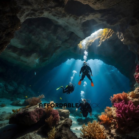 Divers in a cave with sunlight streaming in