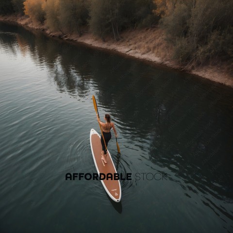 Man Paddling Surfboard in Calm Water